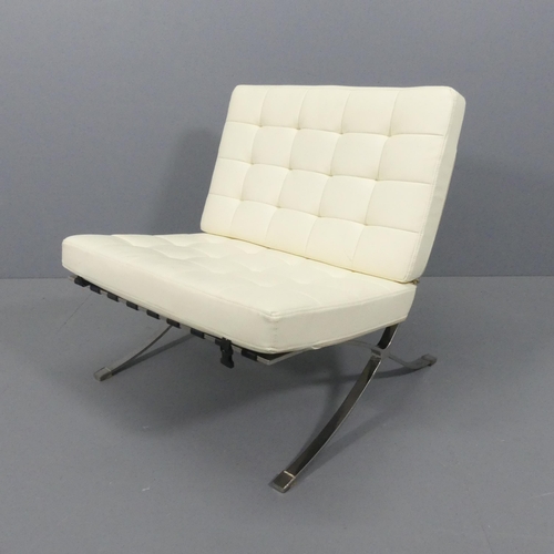 2087 - A Barcelona style lounge chair, upholstered in cream faux leather.