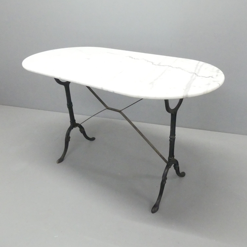 2088 - An oval marble topped table on cast iron base. 121x74x60cm.