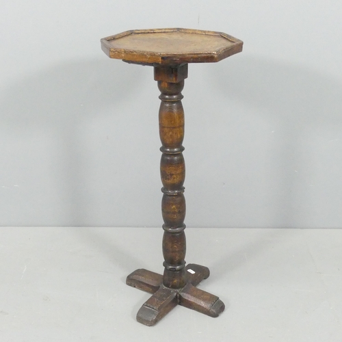 2211 - An antique oak octagonal-topped wine table / plant stand. 31x73cm.