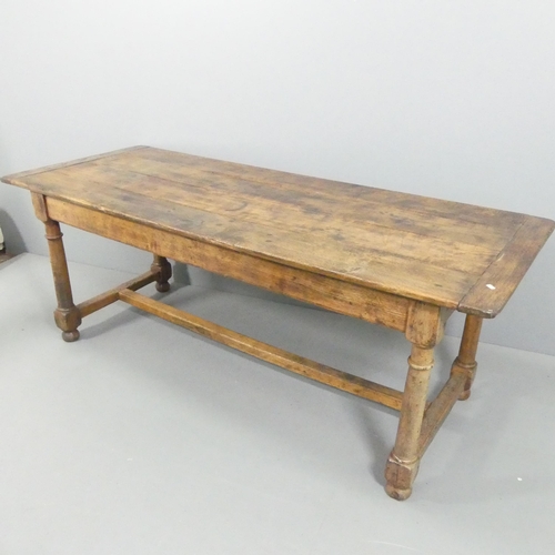 2216 - An antique oak plank-top refectory dining table, raised on turned legs with H-shaped stretcher. 208x... 