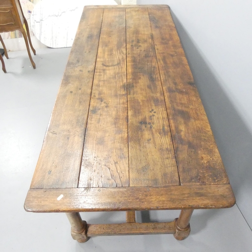 2216 - An antique oak plank-top refectory dining table, raised on turned legs with H-shaped stretcher. 208x... 