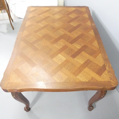 2219 - A French oak parquetry-top draw-leaf dining table. 150 (extending to 250cm) x76x100cm