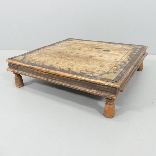 2240 - An antique Indian Bajot low table, with brass and and incised decoration. 62x17x63cm.