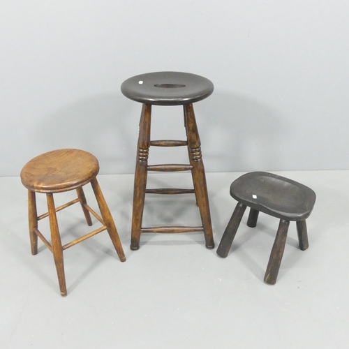 2241 - Three various elm-seated stools. Tallest 61xm.