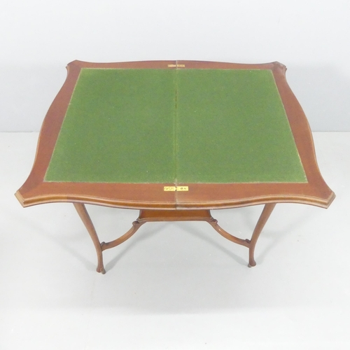 2243 - A reproduction mahogany fold-over card table. 71x74x43cm.