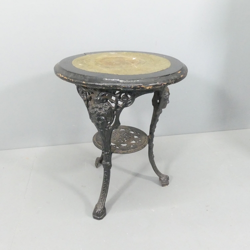 2250 - A painted circular topped garden table on cast iron base. 59x71cm