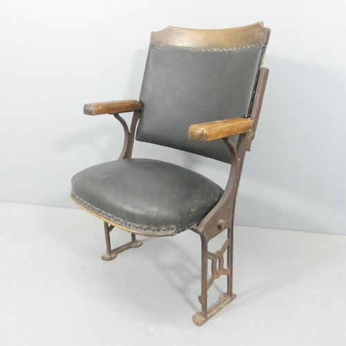 2251 - A vintage folding leather upholstered cinema seat on cast iron frame. Overall 59x93x42cm, seat 46x44... 