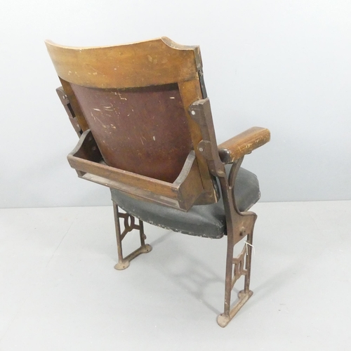 2251 - A vintage folding leather upholstered cinema seat on cast iron frame. Overall 59x93x42cm, seat 46x44... 