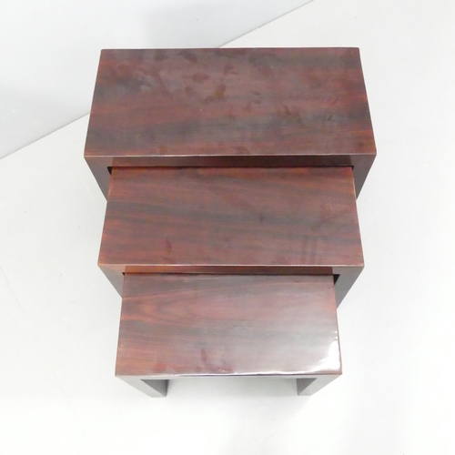 2256 - A modern rosewood veneered nest of three rectangular occasional tables. Largest 60x49x30cm.