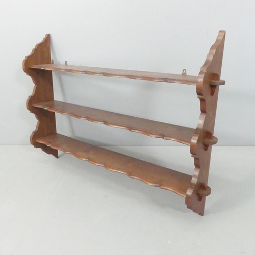 2259 - A mahogany three-tier hanging shelf. 112x80x20cm.