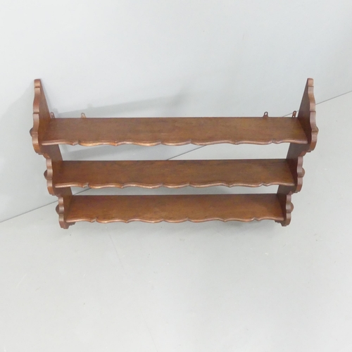 2259 - A mahogany three-tier hanging shelf. 112x80x20cm.