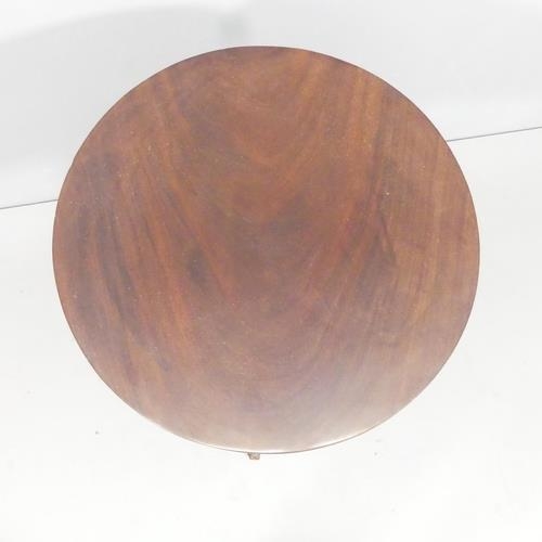 2269 - An antique mahogany circular tilt-top occasional table. 54x72cm.