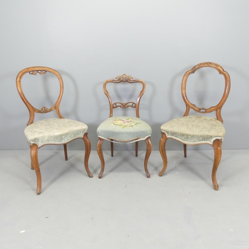 2654 - Two similar walnut balloon back dining chairs, and a walnut and needlepoint upholstered parlour chai... 