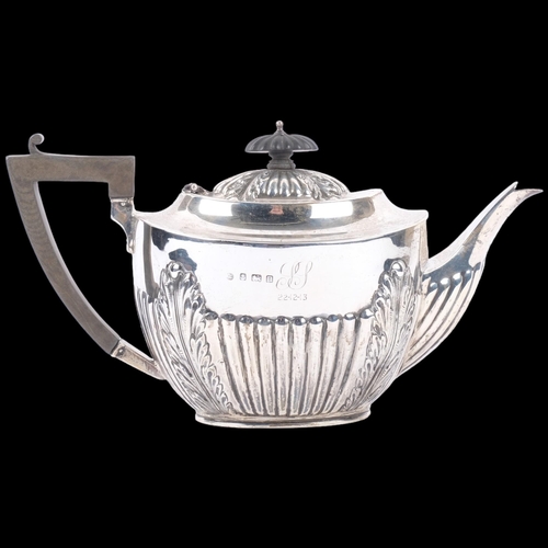 1043 - A George V silver teapot, Alexander Clark & Co Ltd, Birmingham 1912, oval form with relief embossed ... 