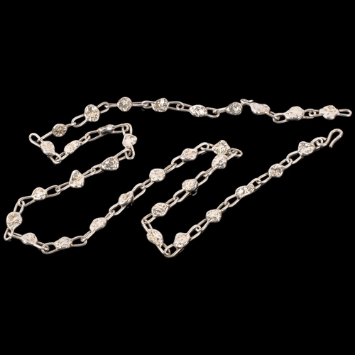 1050 - A long and heavy silver plated abstract link chain necklace, 76cm