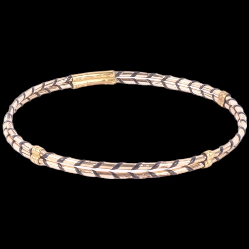 1051 - A yellow metal and elephant hair woven bangle, 2.6g