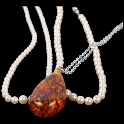 1059 - 2 single-strand pearl bead necklaces with silver clasps, and an amber pendant necklace (3)