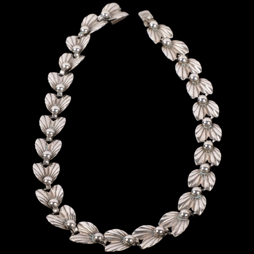 1094 - HERMANN SIERSBOL - a Danish sterling silver leaf and berry panel necklace, 37cm