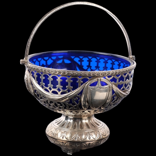 1112 - An Edwardian silver pedestal swing-handled sugar bowl, George Nathan & Ridley Hayes, Chester 1901, c... 