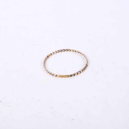 1051 - A yellow metal and elephant hair woven bangle, 2.6g