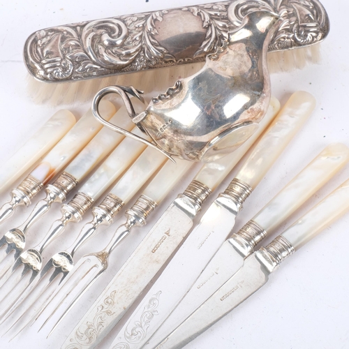 1080 - A Victorian Aesthetic Movement silver cream jug, reg. no. 5073, silver clothes brush, and a part set... 