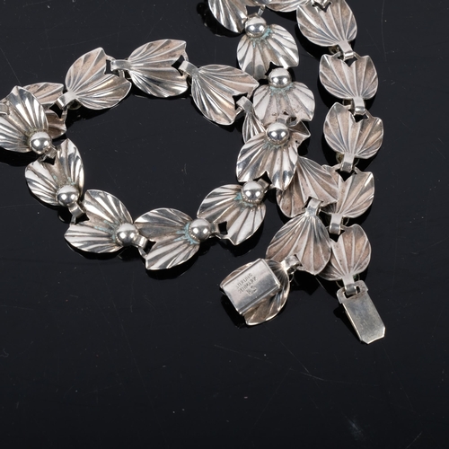 1094 - HERMANN SIERSBOL - a Danish sterling silver leaf and berry panel necklace, 37cm