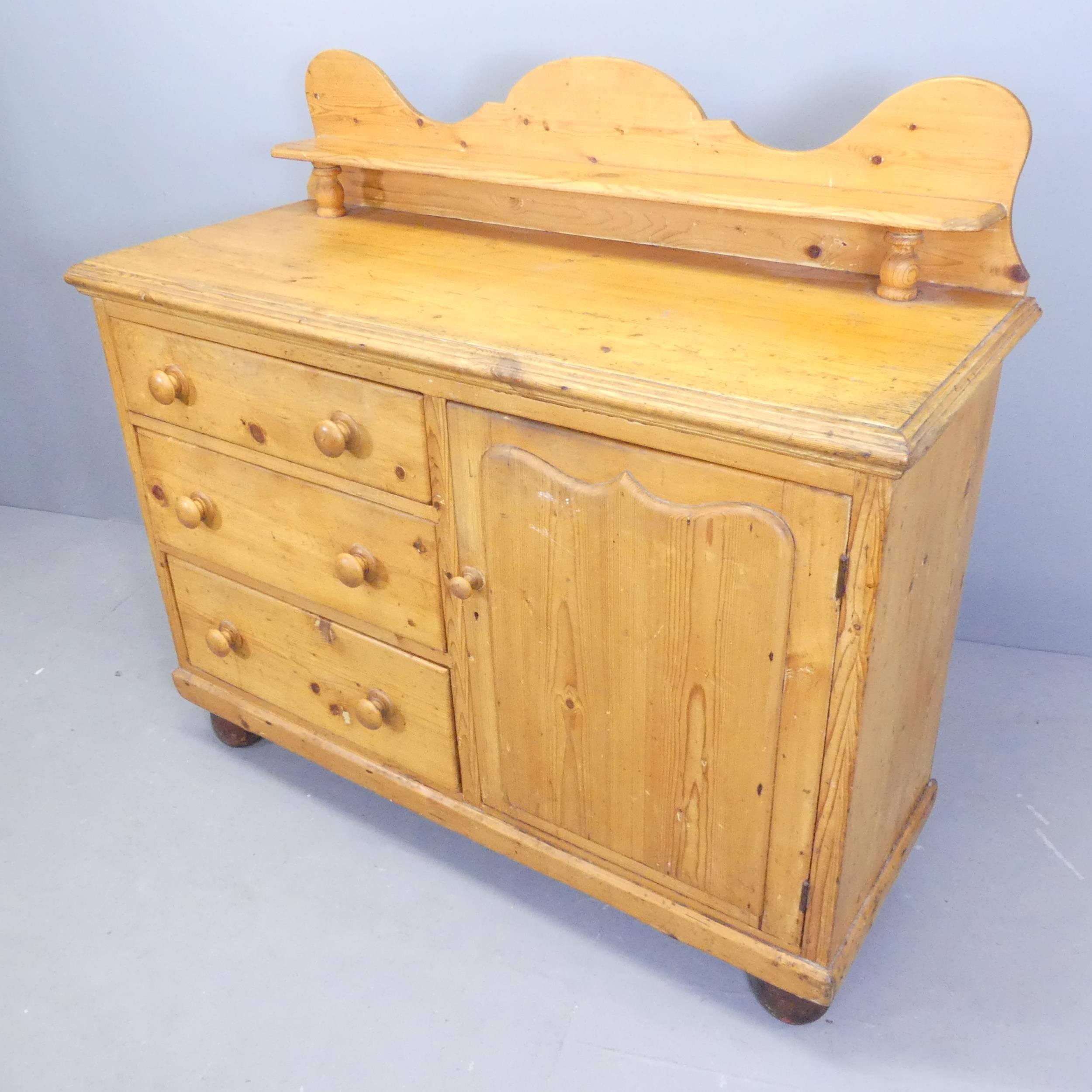A vintage pine dresser. with three drawers and single panelled door