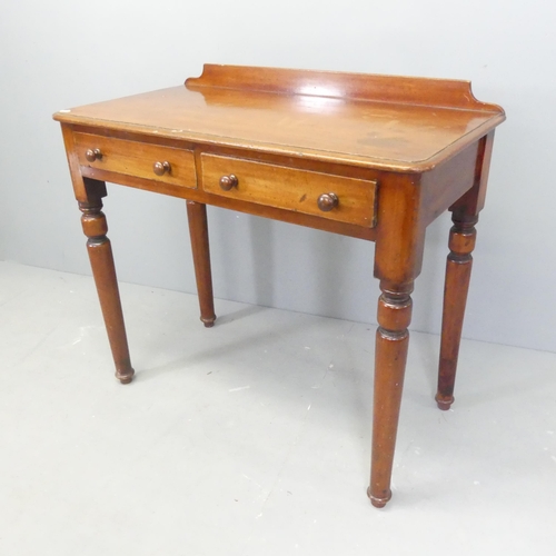 2553 - A Victorian mahogany writing table, with raised back, two frieze drawers and raised on turned legs. ... 