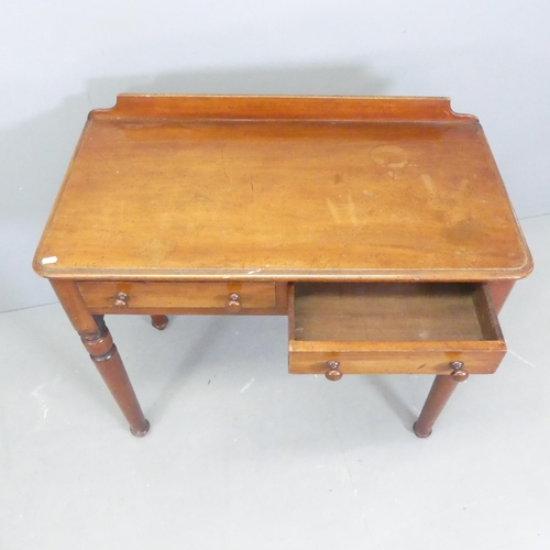 2553 - A Victorian mahogany writing table, with raised back, two frieze drawers and raised on turned legs. ... 