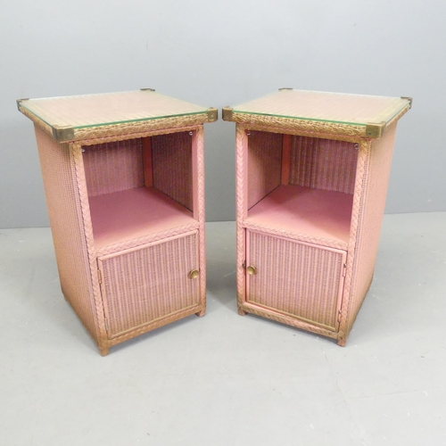 2554 - A pair of pink Lloyd loom bedside tables. 41x65cm.