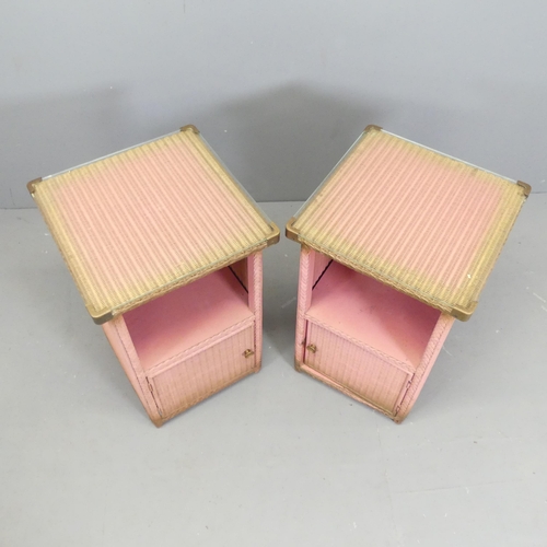 2554 - A pair of pink Lloyd loom bedside tables. 41x65cm.