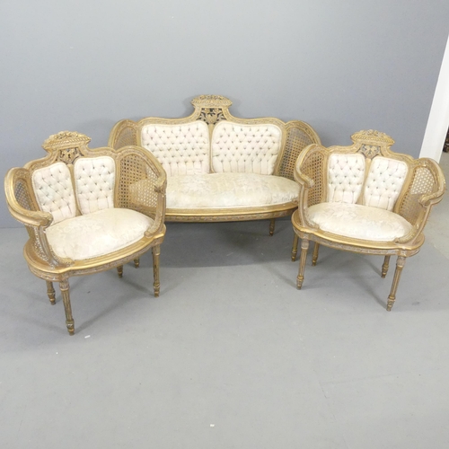 2556 - A French gilt-painted and upholstered salon suite comprising a two-seater settee, and two matching c... 