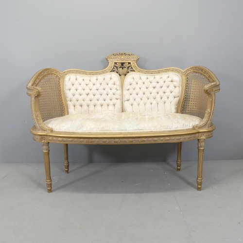 2556 - A French gilt-painted and upholstered salon suite comprising a two-seater settee, and two matching c... 