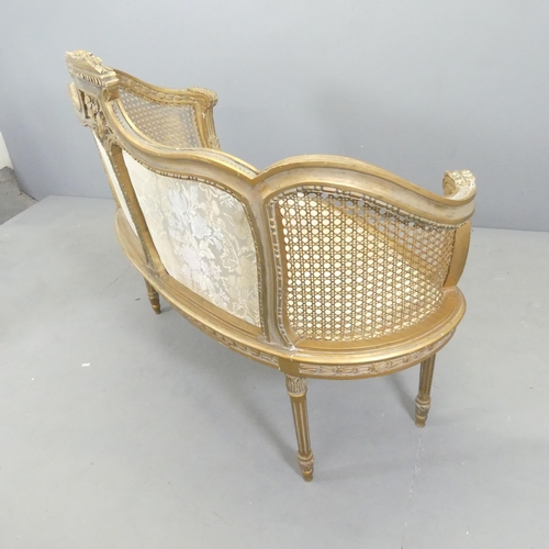 2556 - A French gilt-painted and upholstered salon suite comprising a two-seater settee, and two matching c... 