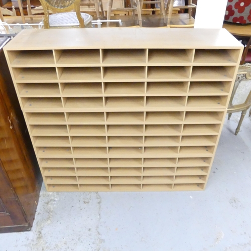 2562 - A modern three-section bank of 60 pigeon holes. 133x124x34cm.