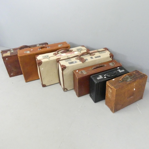 2563 - Seven various suitcases, including two with MOD arrow marks dated 1982. Largest 72x20x41cm.