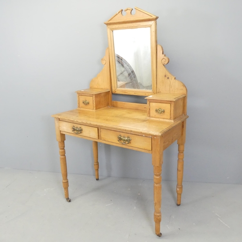 2564 - A light pine mirror-back dressing table. 90x150x46cm.