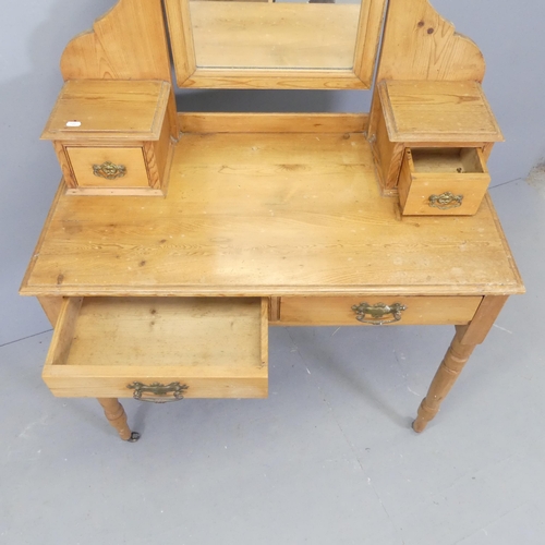 2564 - A light pine mirror-back dressing table. 90x150x46cm.