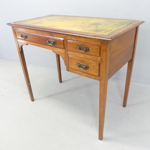 2569 - A Victorian mahogany writing table, with inset tooled and embossed green leather skiver and three dr... 