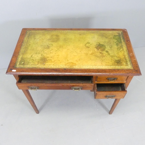 2569 - A Victorian mahogany writing table, with inset tooled and embossed green leather skiver and three dr... 