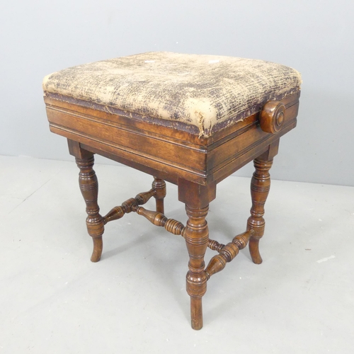 2570 - A Victorian mahogany aesthetic movement piano stool with upholstered seat. 49x50x37cm.