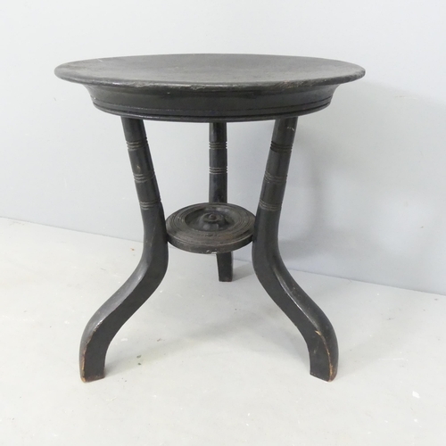 2579 - A Victorian aesthetic style ebonised stool. Height 39cm.