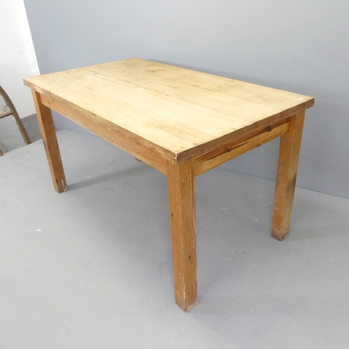 2581 - A maple plank-top table with label for Wood Welded West, Michigan, on pitch pine base. 137x76x78cm.