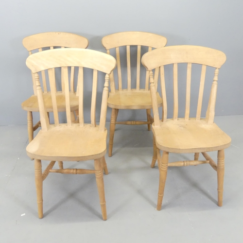 2583 - A set of four modern beech stick-back dining chairs.