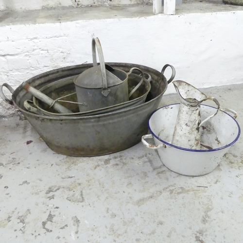 2590 - Two galvanised wash basins, a watering can, and an enamelled wash bowl and jug (5). Largest 80x27x55... 