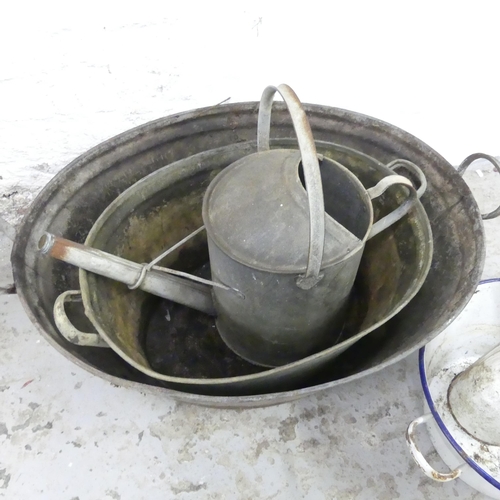 2590 - Two galvanised wash basins, a watering can, and an enamelled wash bowl and jug (5). Largest 80x27x55... 