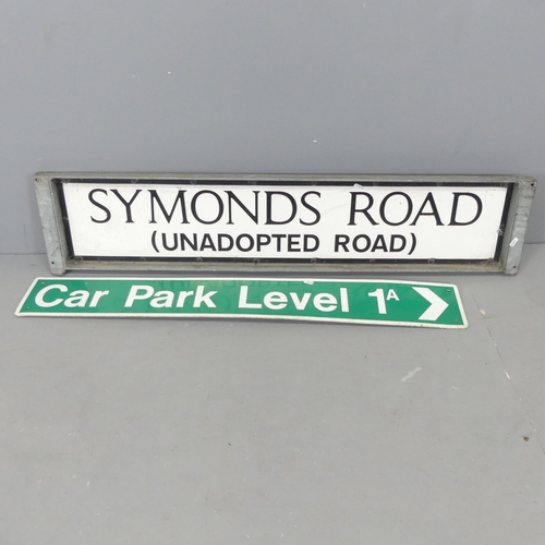 2592 - Two metal road signs, one in galvanised mount. Largest 123x26cm.