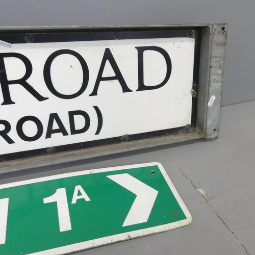 2592 - Two metal road signs, one in galvanised mount. Largest 123x26cm.