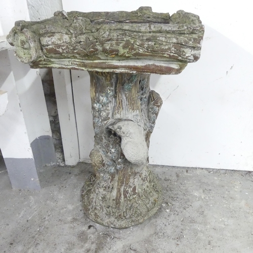 2594 - A weathered concrete two-section bird bath. 36x60cm.