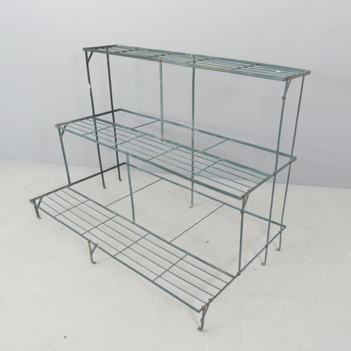 2598 - A painted metal three-tier plant stand. 101x75x61cm